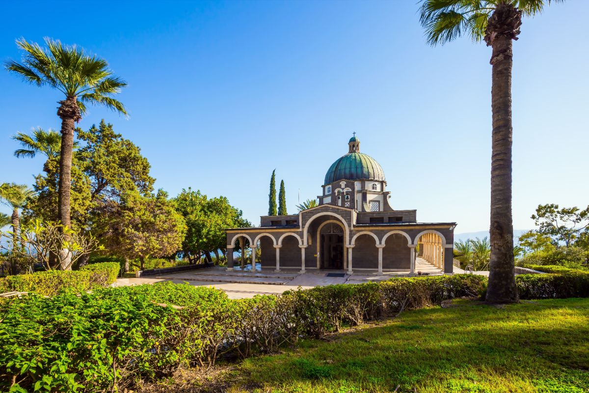 The Church of the Beatitudes among palms and gardens above the Sea of Galilee